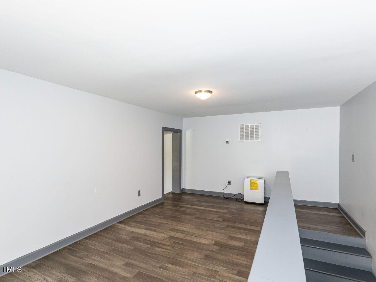 10336 Old Beulah Road Kenly, NC 27542 - Photo 57 of 71 a view of empty room with wooden floor