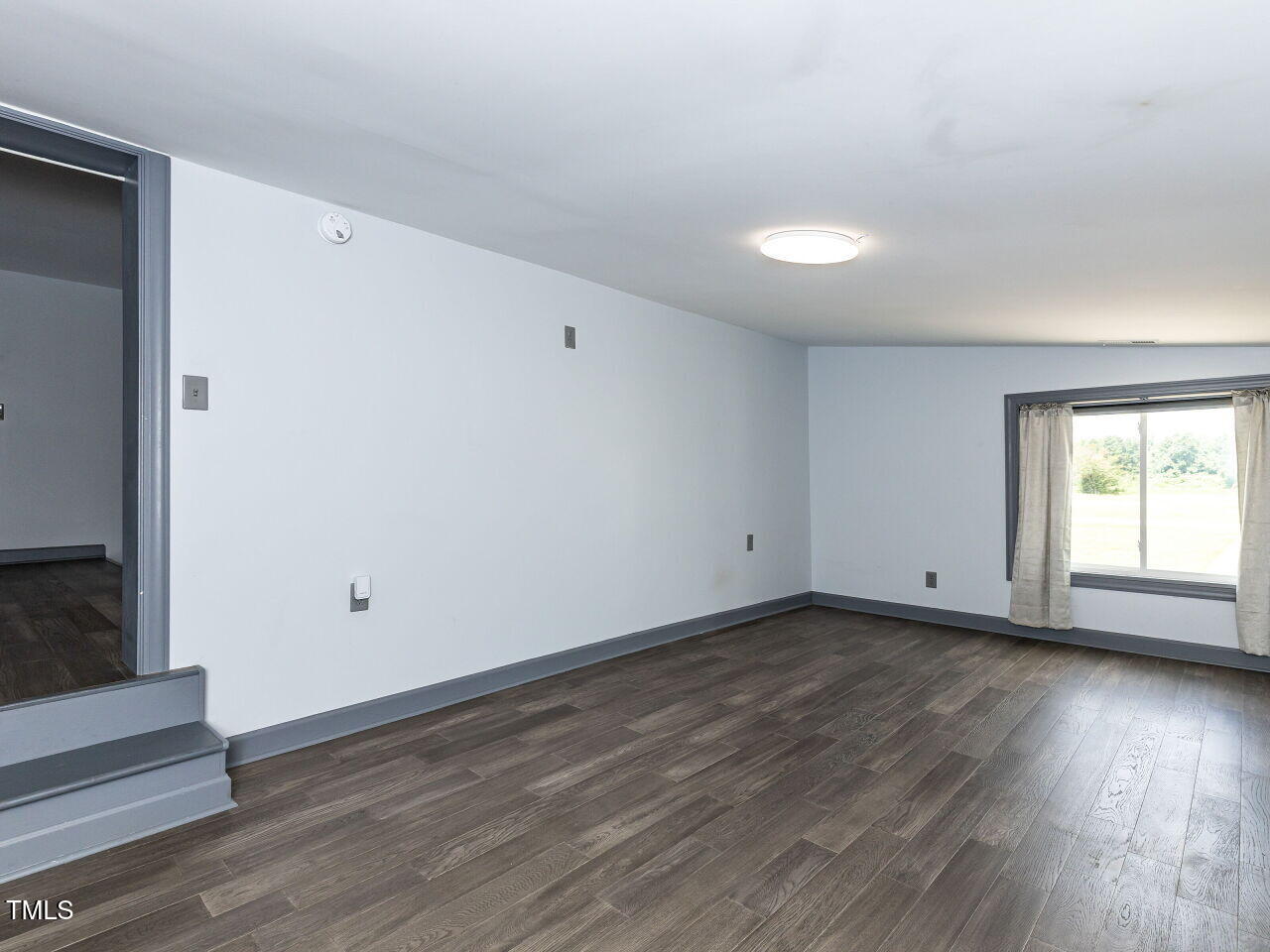 10336 Old Beulah Road Kenly, NC 27542 - Photo 60 of 71 a view of a room with wooden floor and window