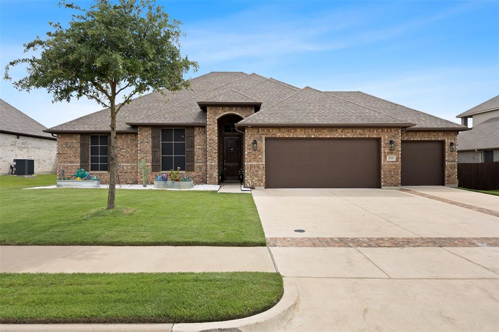 2618 Byrd Ranch Road Midlothian, TX 76065 - Photo 38 of 38 a front view of a house with a garden and yard