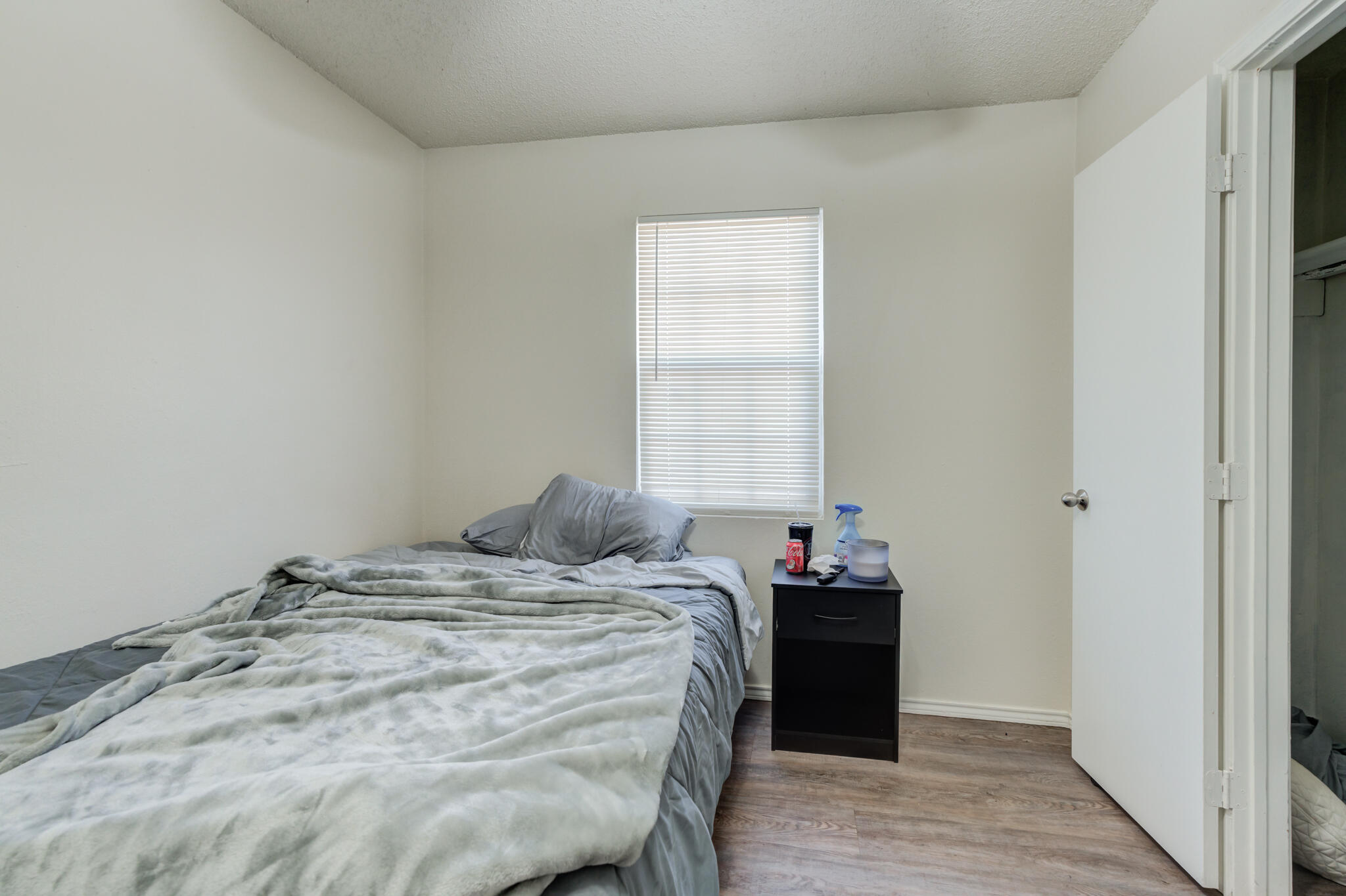 6210 22nd Street Lubbock, TX 79407 - Photo 17 of 18 a bedroom with a bed and a window