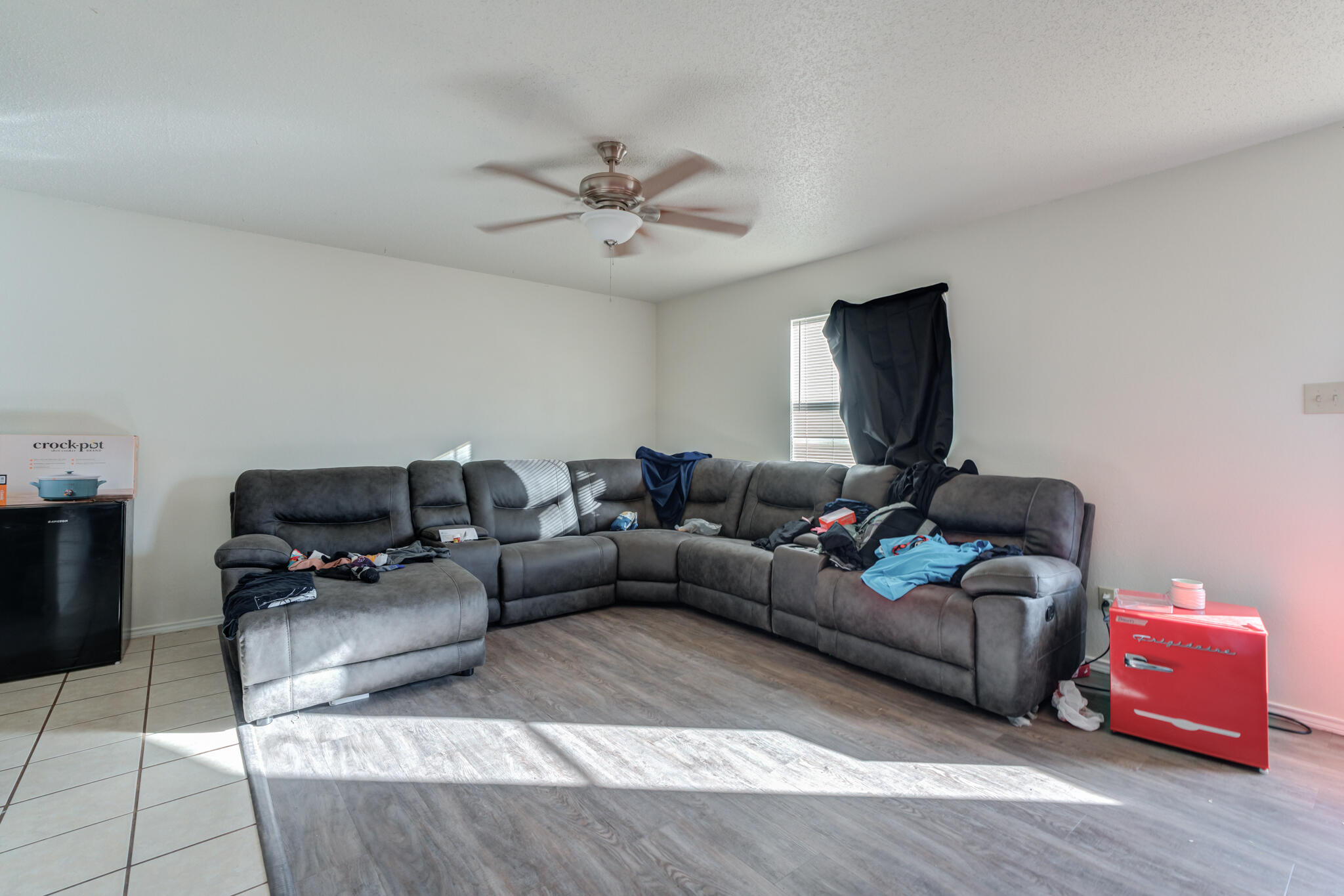 6210 22nd Street Lubbock, TX 79407 - Photo 4 of 18 a living room with furniture and a flat screen tv