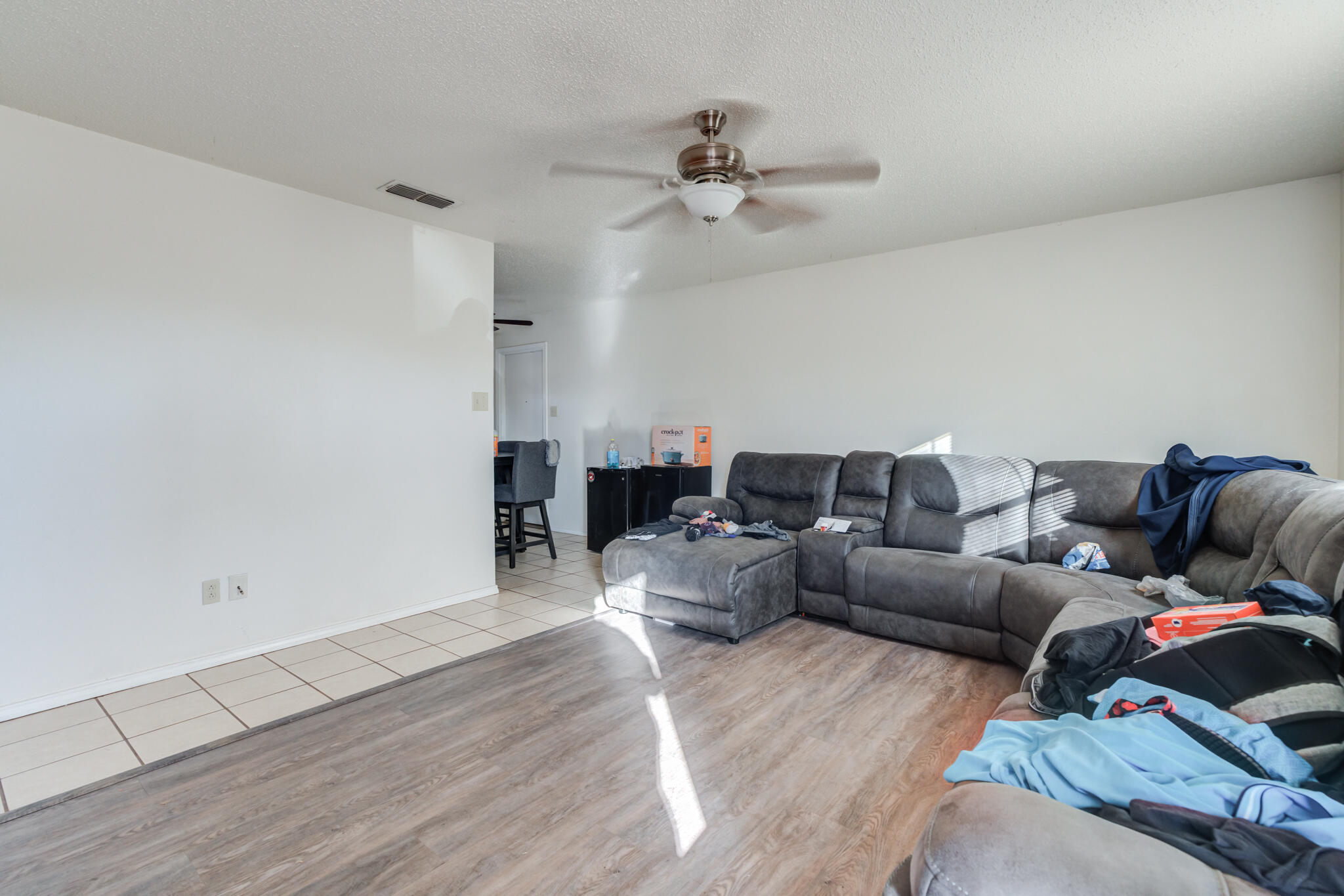 6210 22nd Street Lubbock, TX 79407 - Photo 6 of 18 a living room with furniture and a wooden floor