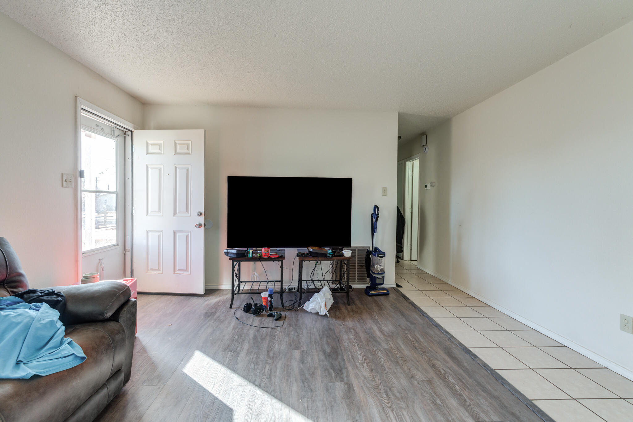 6210 22nd Street Lubbock, TX 79407 - Photo 7 of 18 a living room with furniture and a flat screen tv