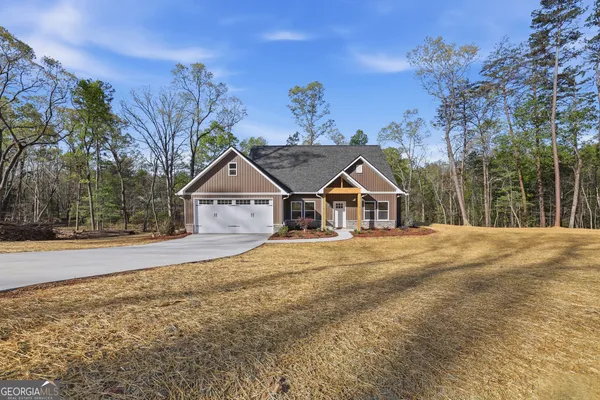 a view of a house with wooden fence