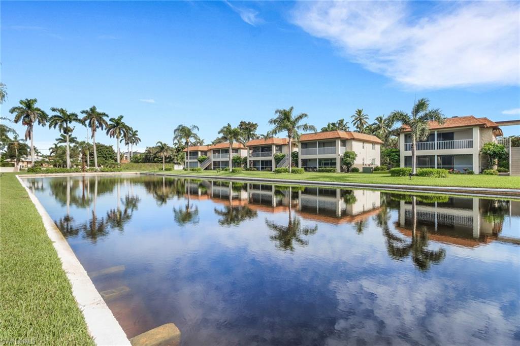 1155 Sandpiper Street, Unit D4 Naples, FL 34102 - Photo 12 of 39 Water view featuring nearby suburban area