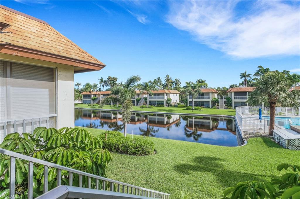 1155 Sandpiper Street, Unit D4 Naples, FL 34102 - Photo 13 of 39 Water view with nearby suburban area