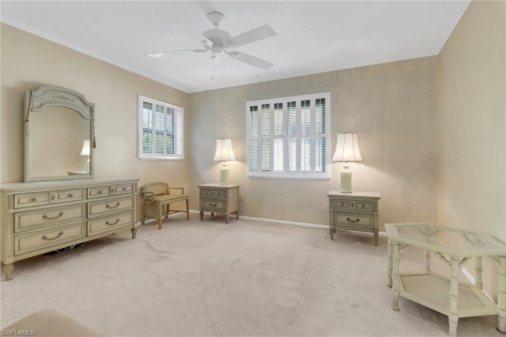 1155 Sandpiper Street, Unit D4 Naples, FL 34102 - Photo 14 of 39 Sitting room featuring ceiling fan, light carpet, and crown molding