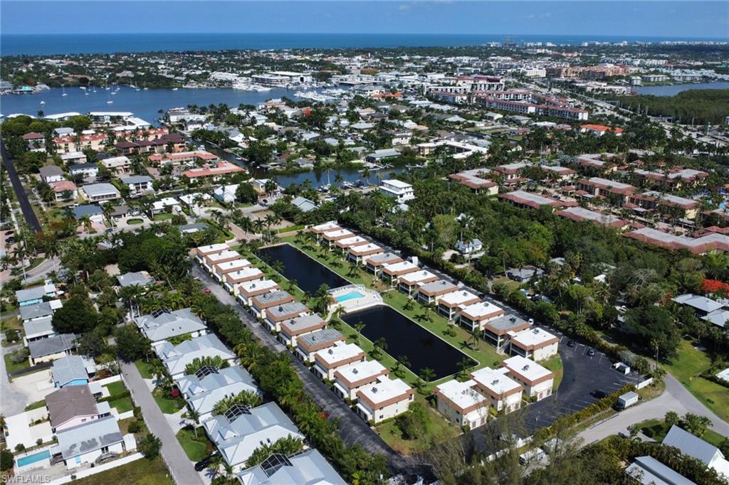 1155 Sandpiper Street, Unit D4 Naples, FL 34102 - Photo 19 of 39 View of property location with a large body of water and nearby suburban area