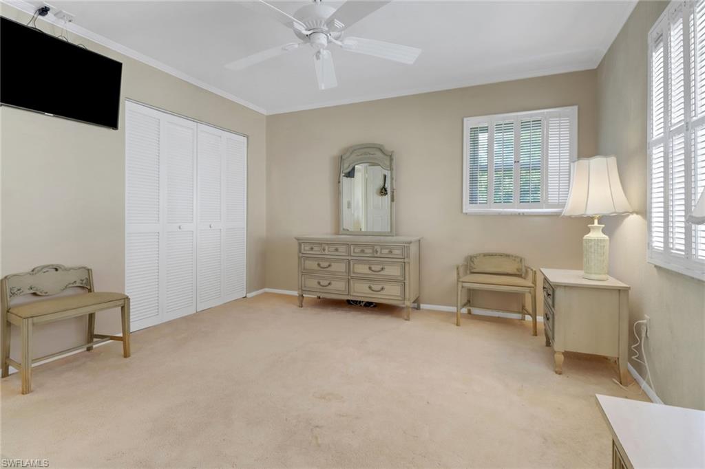 1155 Sandpiper Street, Unit D4 Naples, FL 34102 - Photo 31 of 39 Sitting room featuring healthy amount of natural light, light carpet, a ceiling fan, and ornamental molding