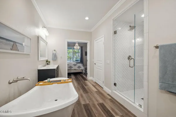 a bathroom with a tub sink and shower