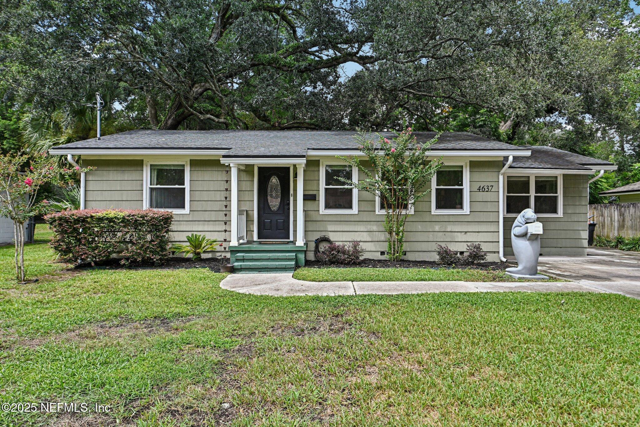 4637 Homestead Road Jacksonville, FL 32210 - Photo 1 of 43 a front view of house with yard and green space