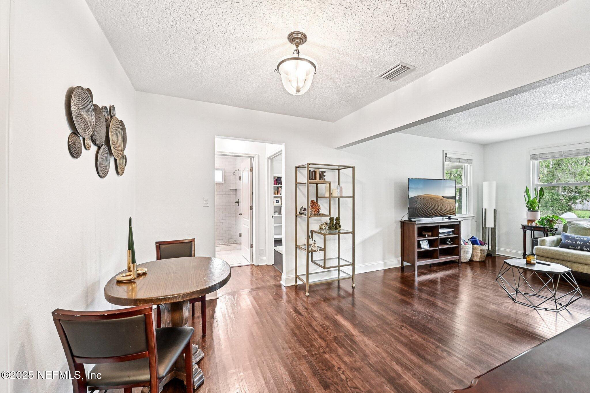 4637 Homestead Road Jacksonville, FL 32210 - Photo 11 of 43 a living room with furniture and a table