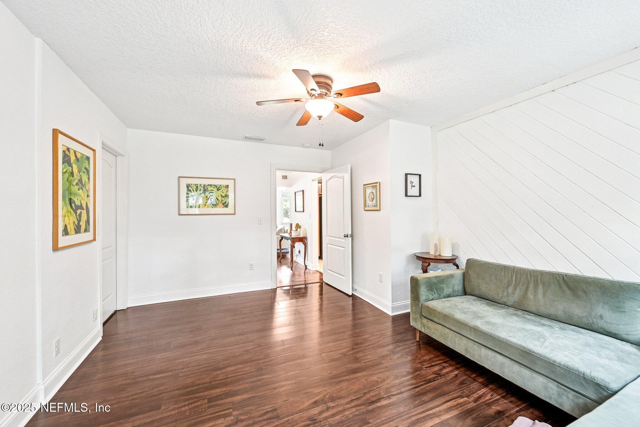 4637 Homestead Road Jacksonville, FL 32210 - Photo 19 of 43 a living room with couches and a coffee table