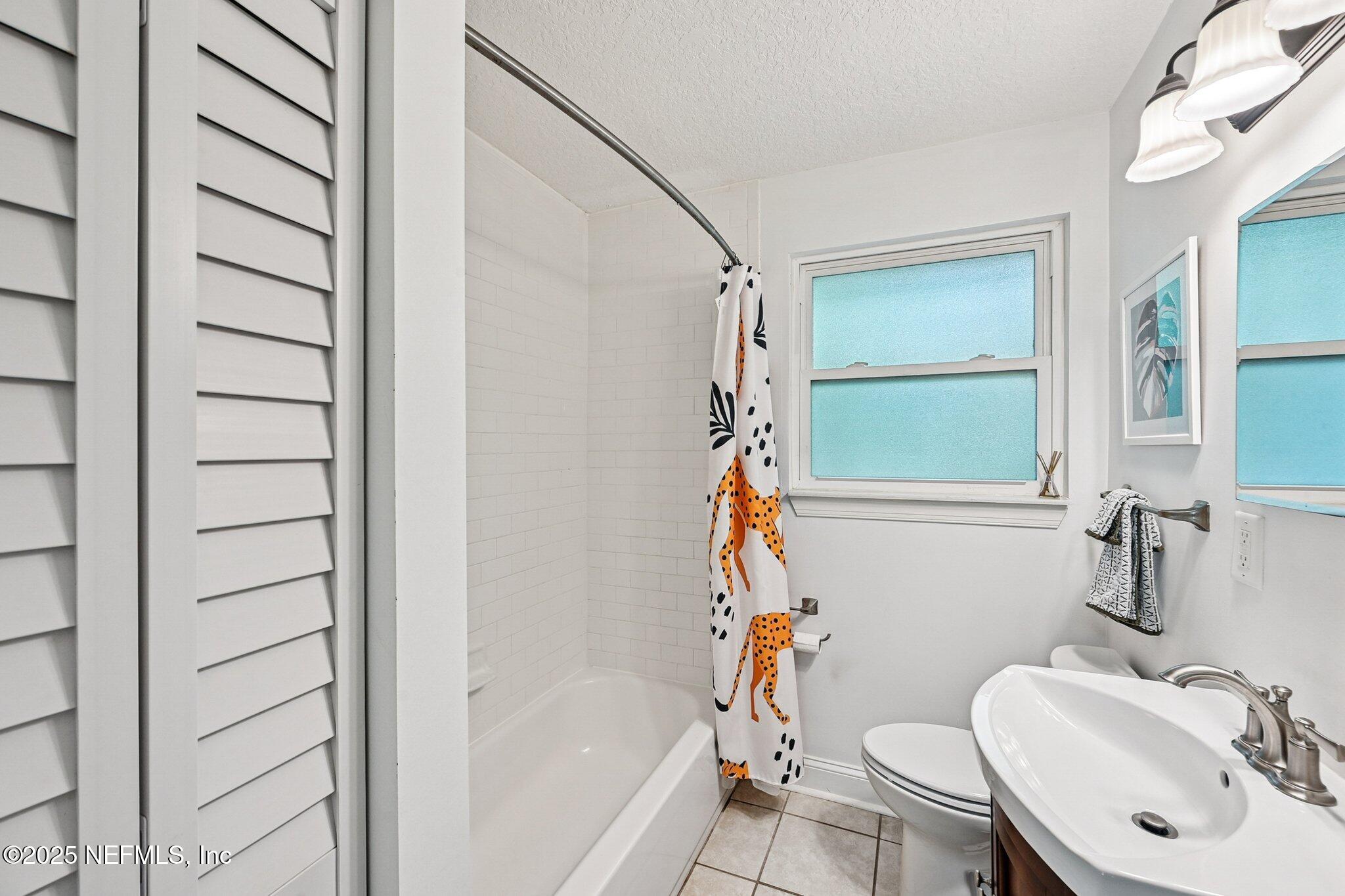 4637 Homestead Road Jacksonville, FL 32210 - Photo 24 of 43 a bathroom with a sink toilet and shower