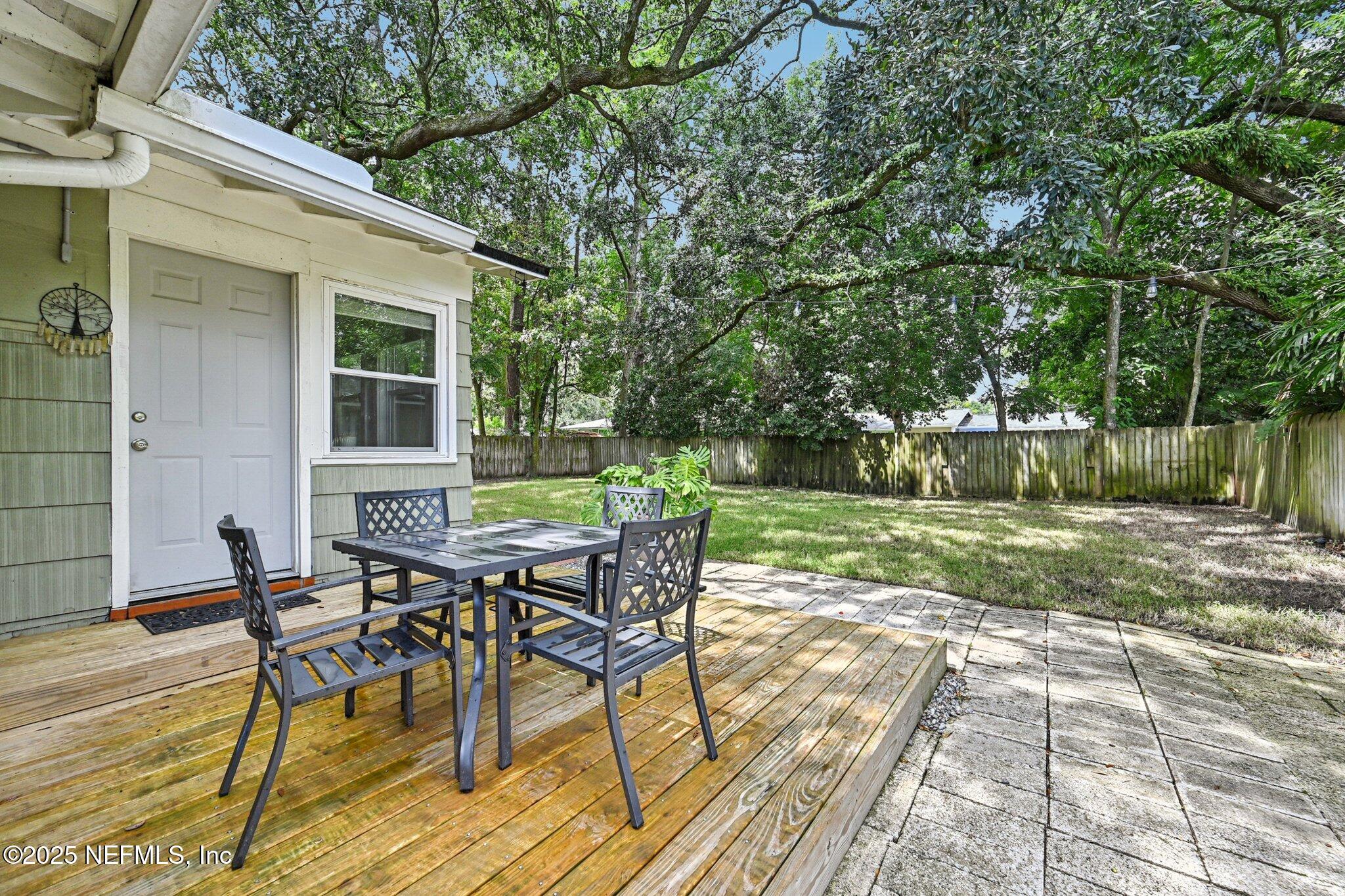4637 Homestead Road Jacksonville, FL 32210 - Photo 29 of 43 a view of a house with backyard and sitting area