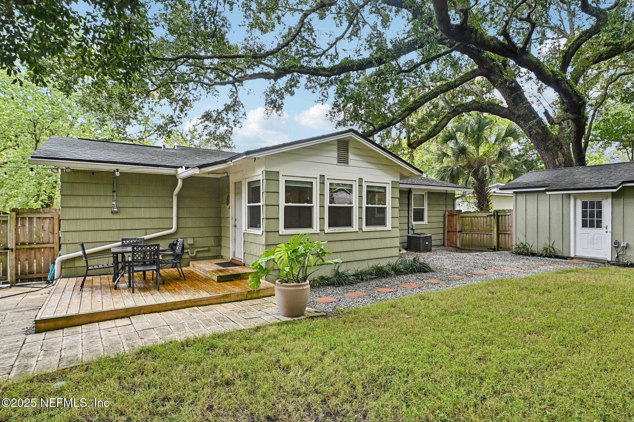 4637 Homestead Road Jacksonville, FL 32210 - Photo 30 of 43 a front view of a house with a yard and porch