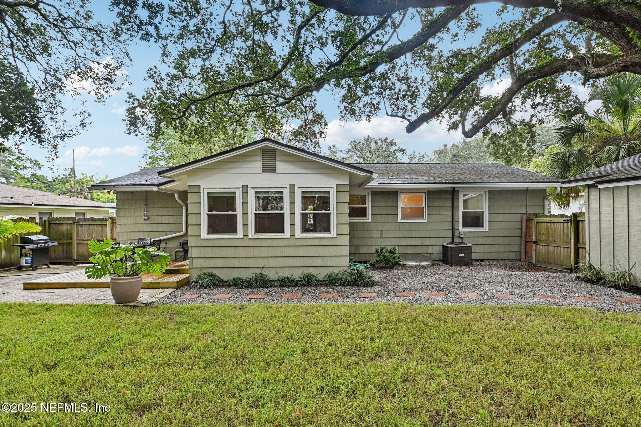 4637 Homestead Road Jacksonville, FL 32210 - Photo 31 of 43 a front view of house with yard and green space