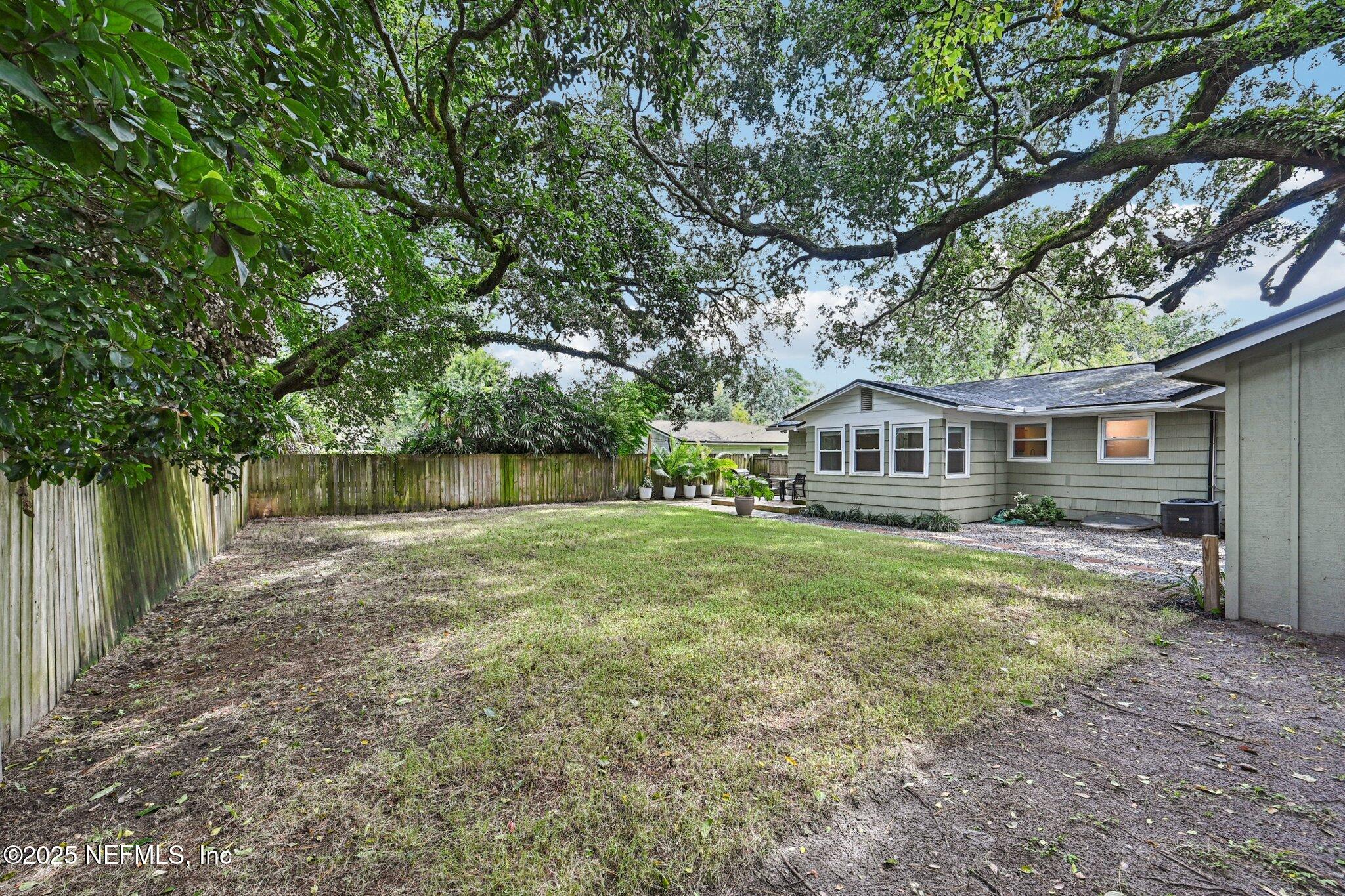 4637 Homestead Road Jacksonville, FL 32210 - Photo 34 of 43 a view of a house with a yard