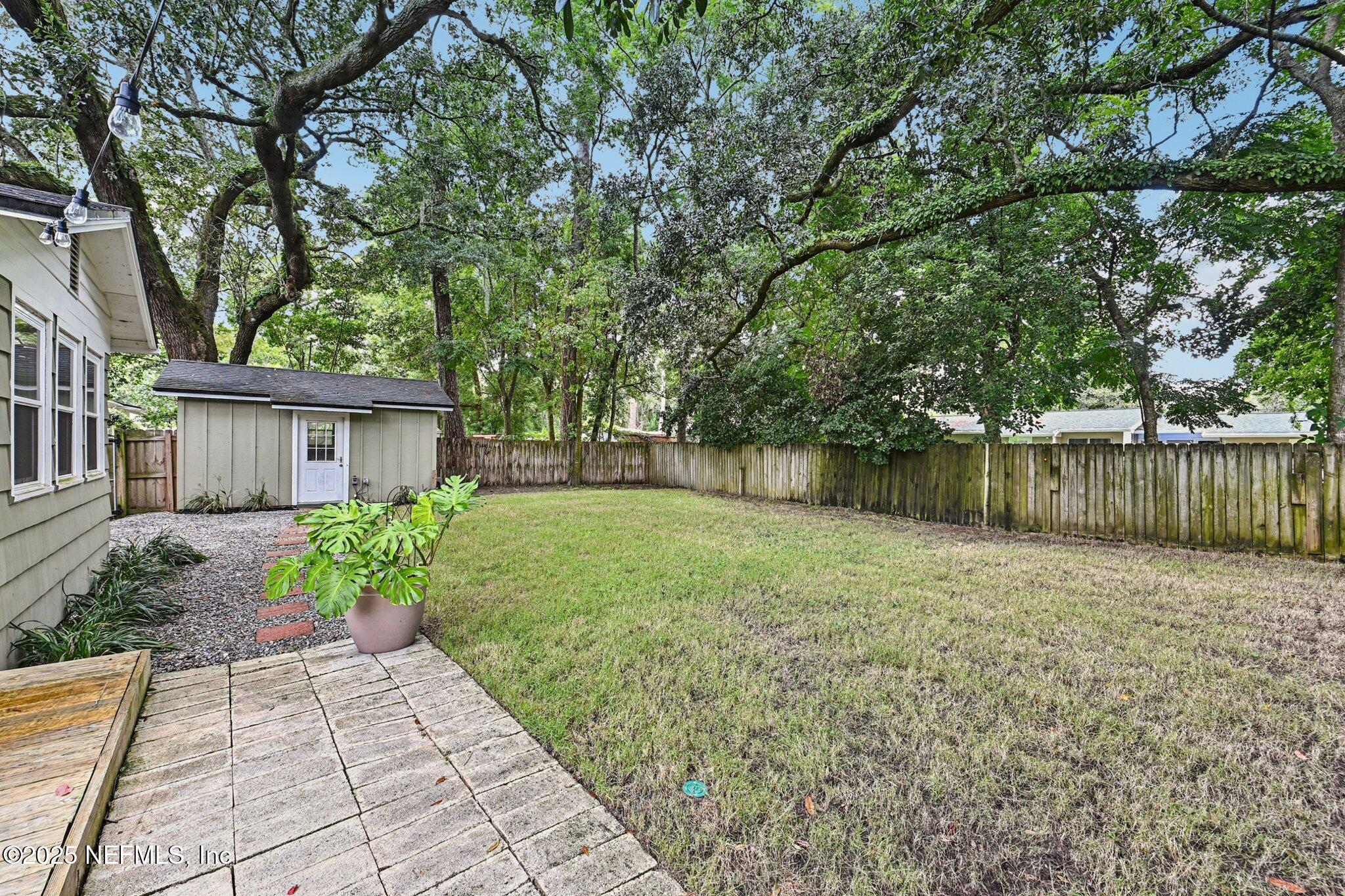 4637 Homestead Road Jacksonville, FL 32210 - Photo 35 of 43 a view of a house with backyard and garden