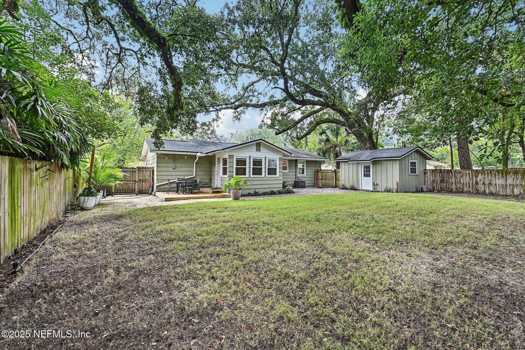 4637 Homestead Road Jacksonville, FL 32210 - Photo 36 of 43 a front view of house with yard and green space
