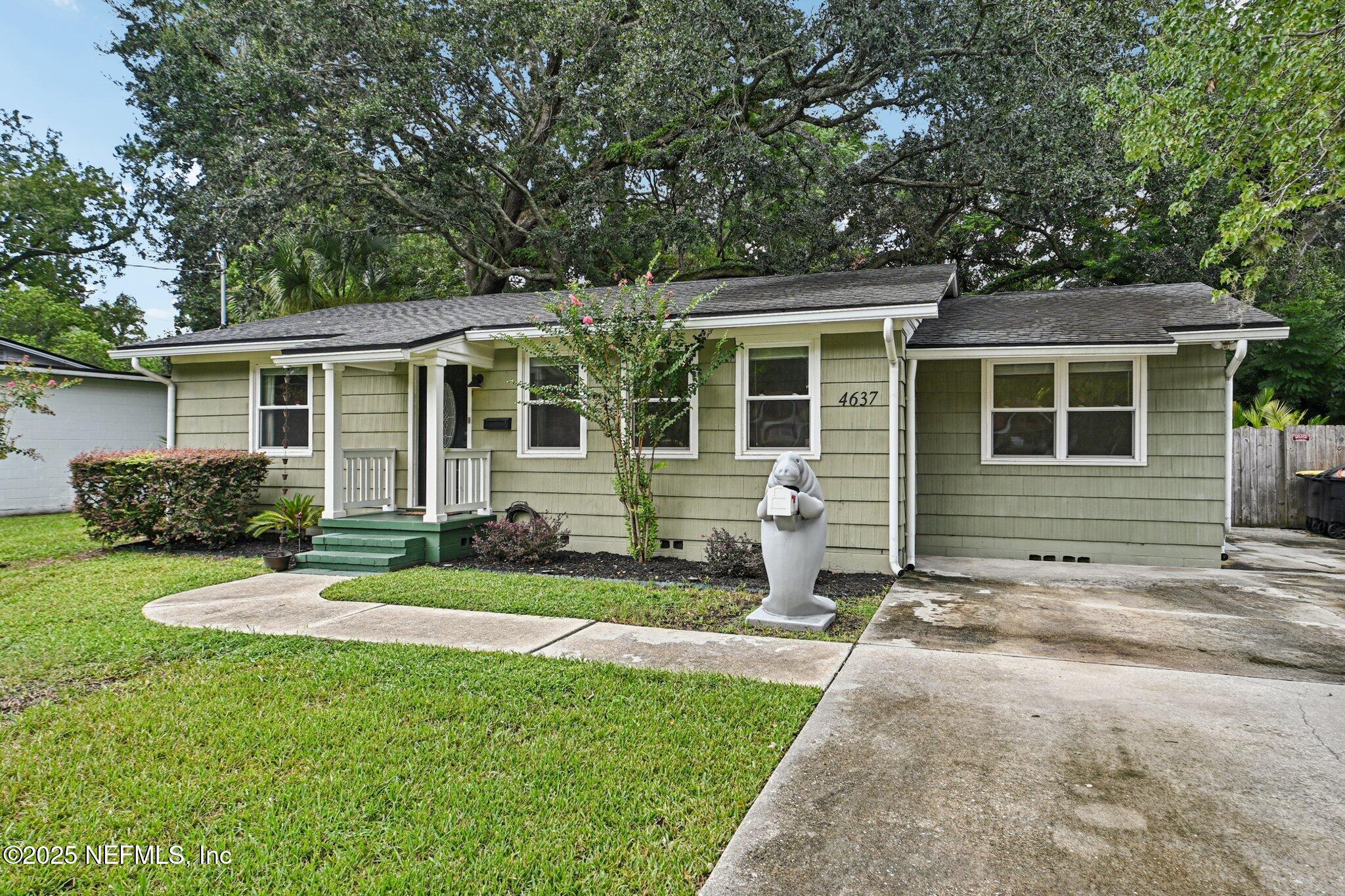 4637 Homestead Road Jacksonville, FL 32210 - Photo 40 of 43 a view of a house with back yard and plants