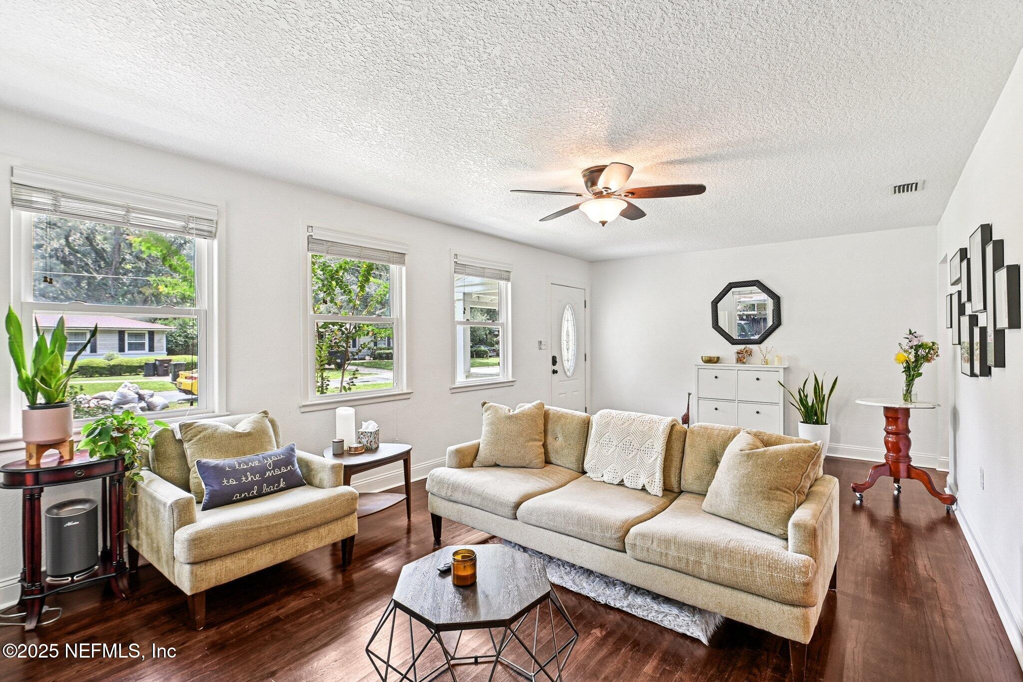4637 Homestead Road Jacksonville, FL 32210 - Photo 5 of 43 a living room with furniture and a large window