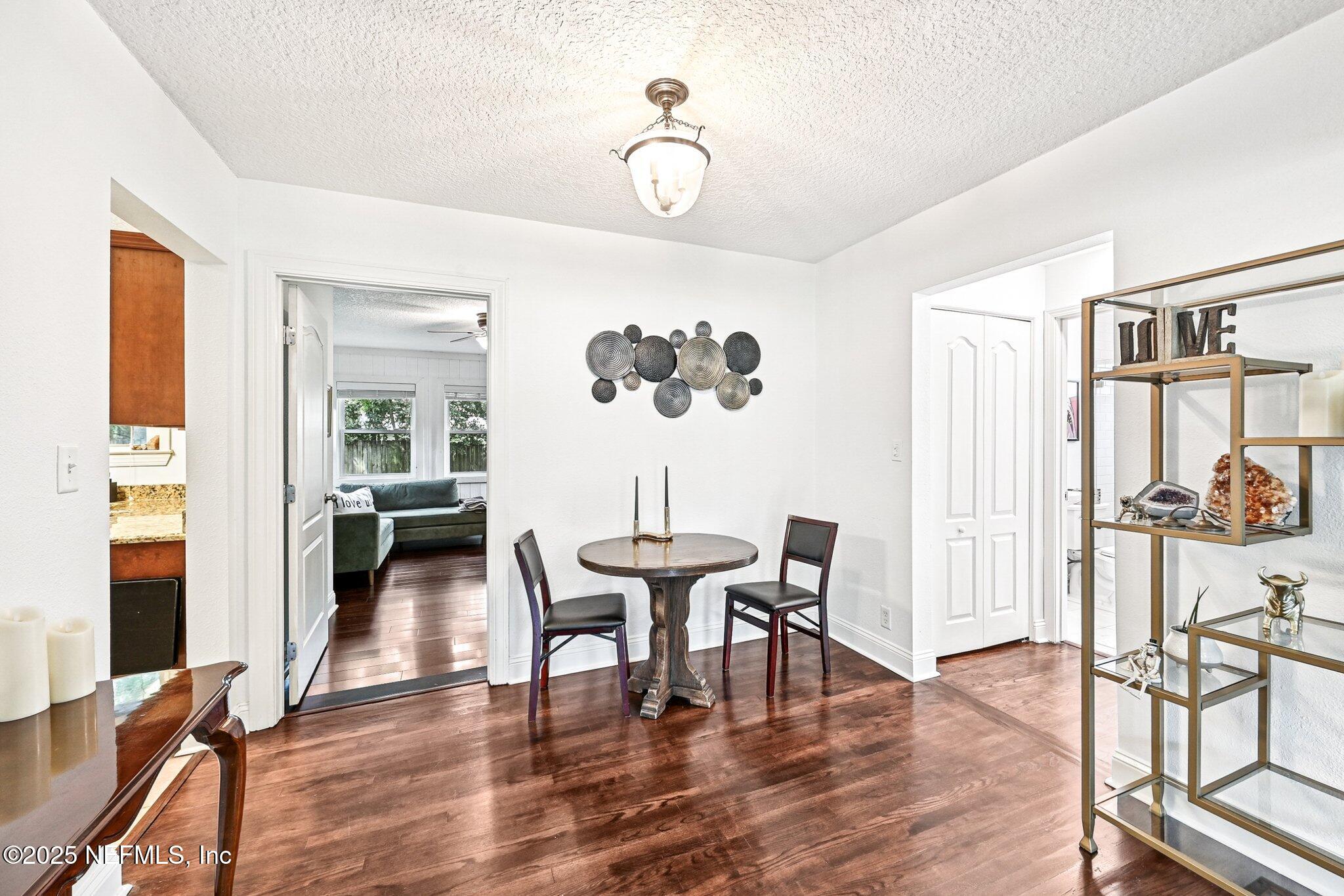4637 Homestead Road Jacksonville, FL 32210 - Photo 9 of 43 a view of a dining room with furniture and wooden floor
