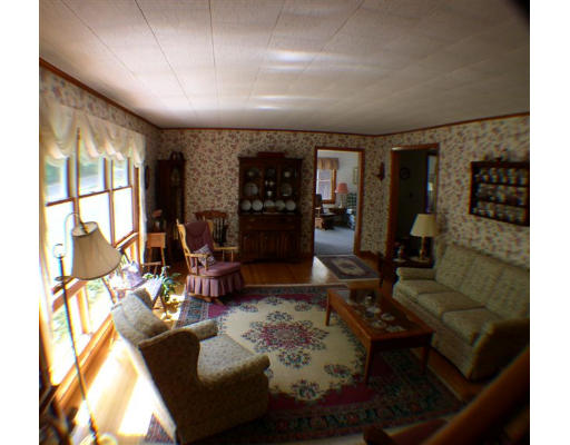 379 Town Farm Road Barre, MA 01005 - Photo 4 of 6 a living room with furniture fireplace and a large window