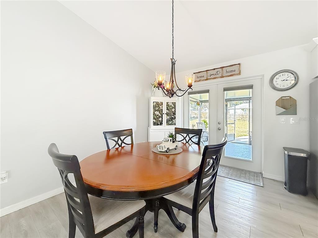 4445 East Maryland Street Inverness, FL 34453 - Photo 18 of 46 a view of a dining room with furniture window and wooden floor