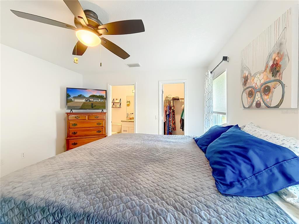 4445 East Maryland Street Inverness, FL 34453 - Photo 26 of 46 a bedroom with a bed and a large closet