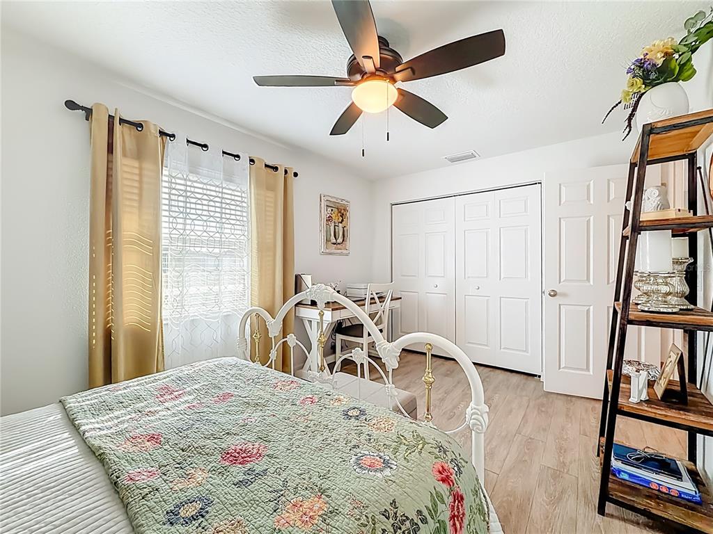 4445 East Maryland Street Inverness, FL 34453 - Photo 33 of 46 a bedroom with furniture and a window