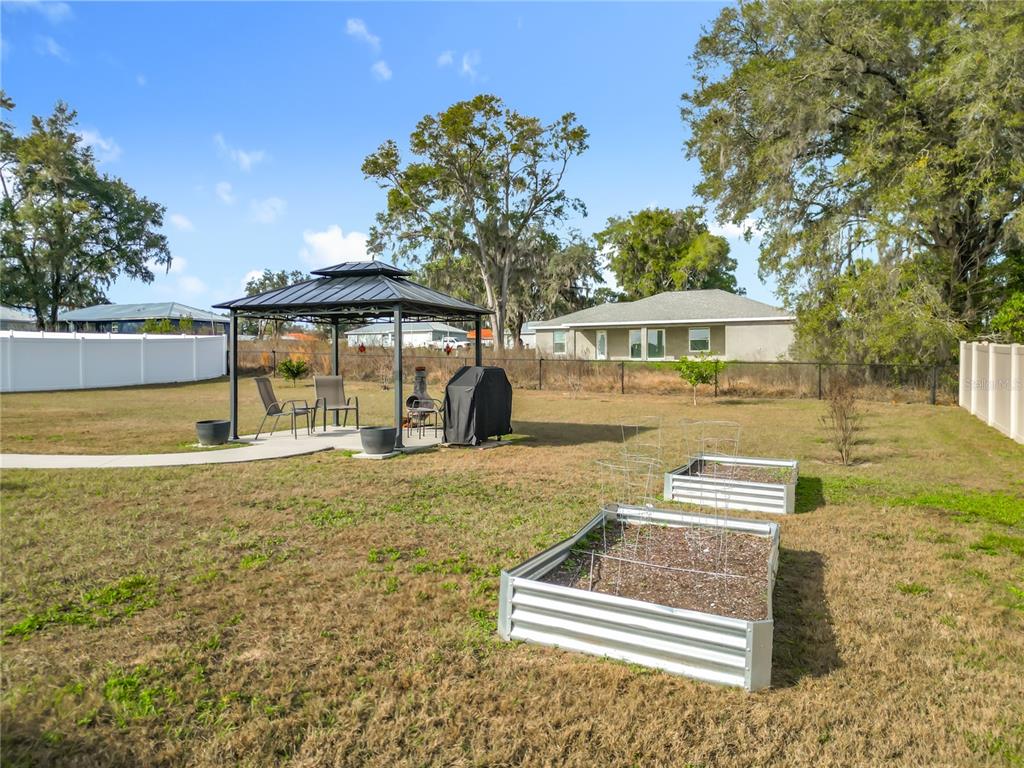 4445 East Maryland Street Inverness, FL 34453 - Photo 41 of 46 a view of swimming pool with lawn chairs and plants