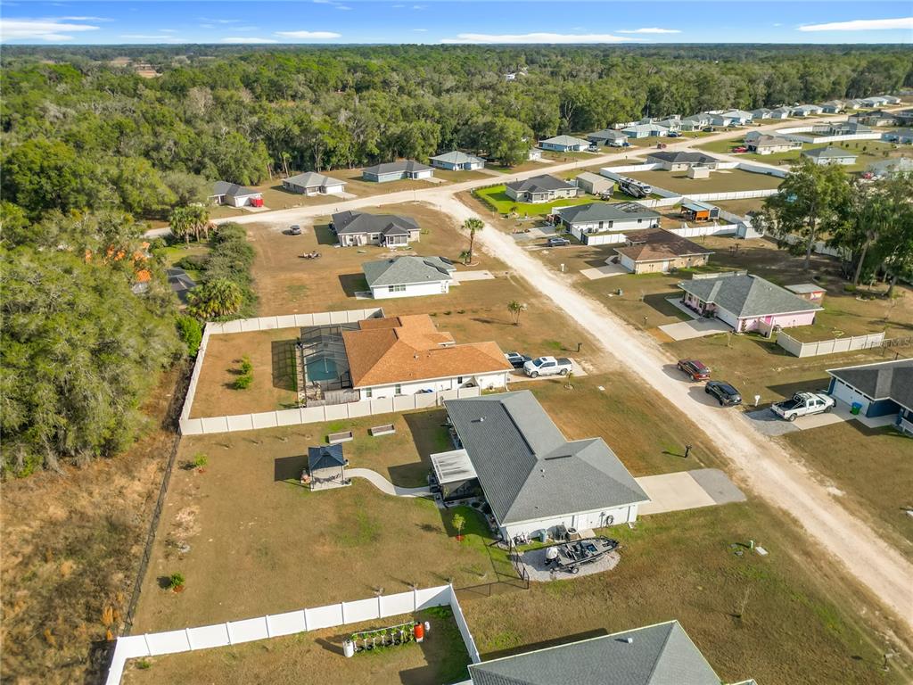 4445 East Maryland Street Inverness, FL 34453 - Photo 44 of 46 an aerial view of residential houses with outdoor space