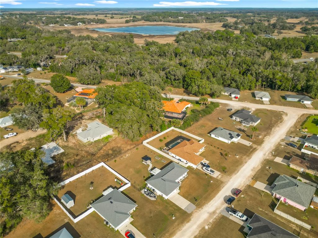 4445 East Maryland Street Inverness, FL 34453 - Photo 5 of 46 an aerial view of residential houses with outdoor space