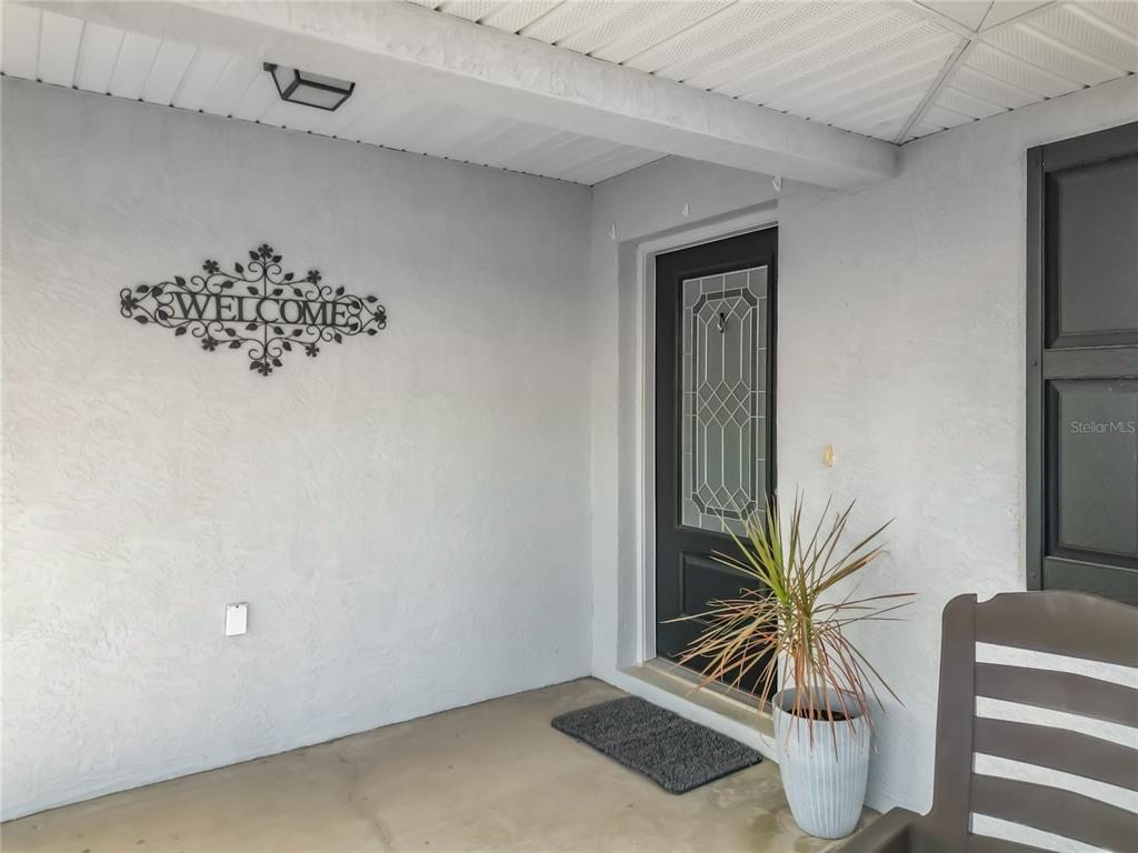 4445 East Maryland Street Inverness, FL 34453 - Photo 10 of 46 a view of a livingroom with wooden floor and a potted plant