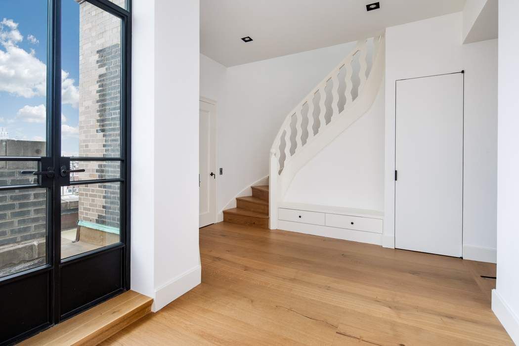 784 Park Avenue, Unit PHC Manhattan, NY 10021 - Photo 13 of 36 a view of room with window and entryway