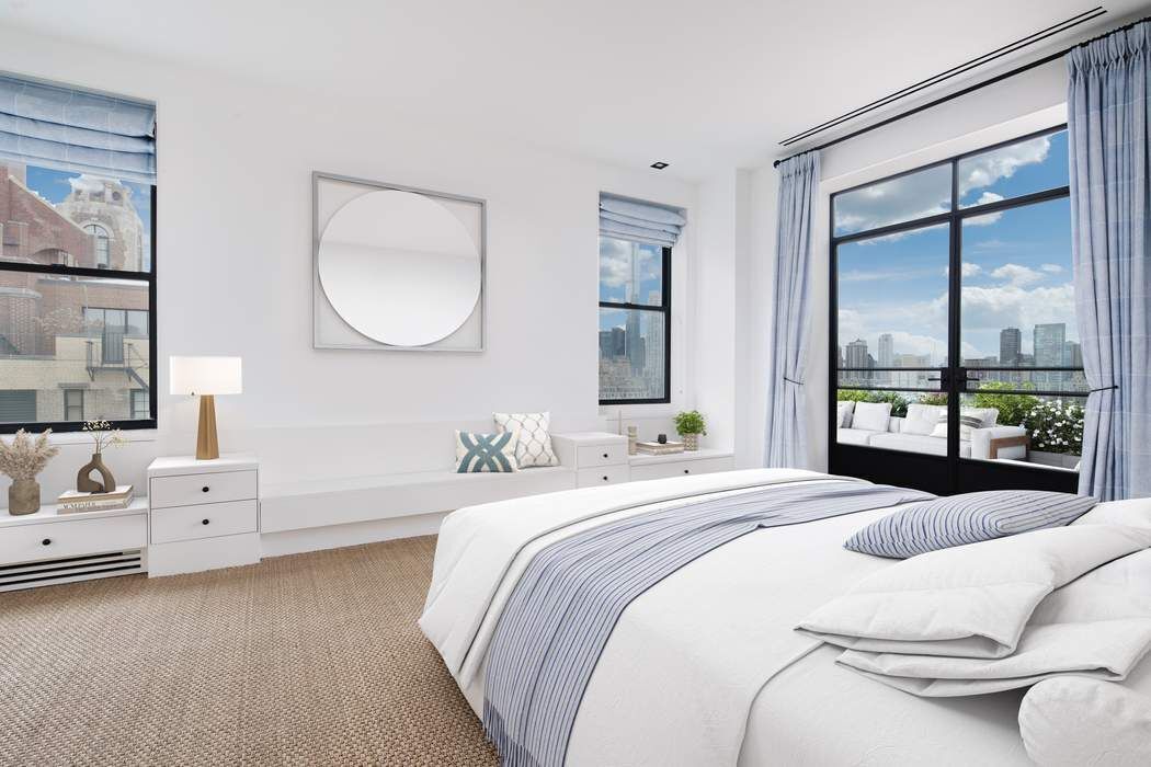 784 Park Avenue, Unit PHC Manhattan, NY 10021 - Photo 14 of 36 a bedroom with a bed and a large mirror next to a window