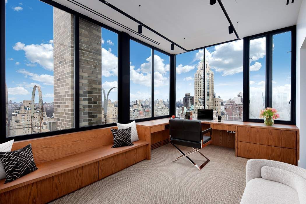 784 Park Avenue, Unit PHC Manhattan, NY 10021 - Photo 22 of 36 a living room with furniture and a large window