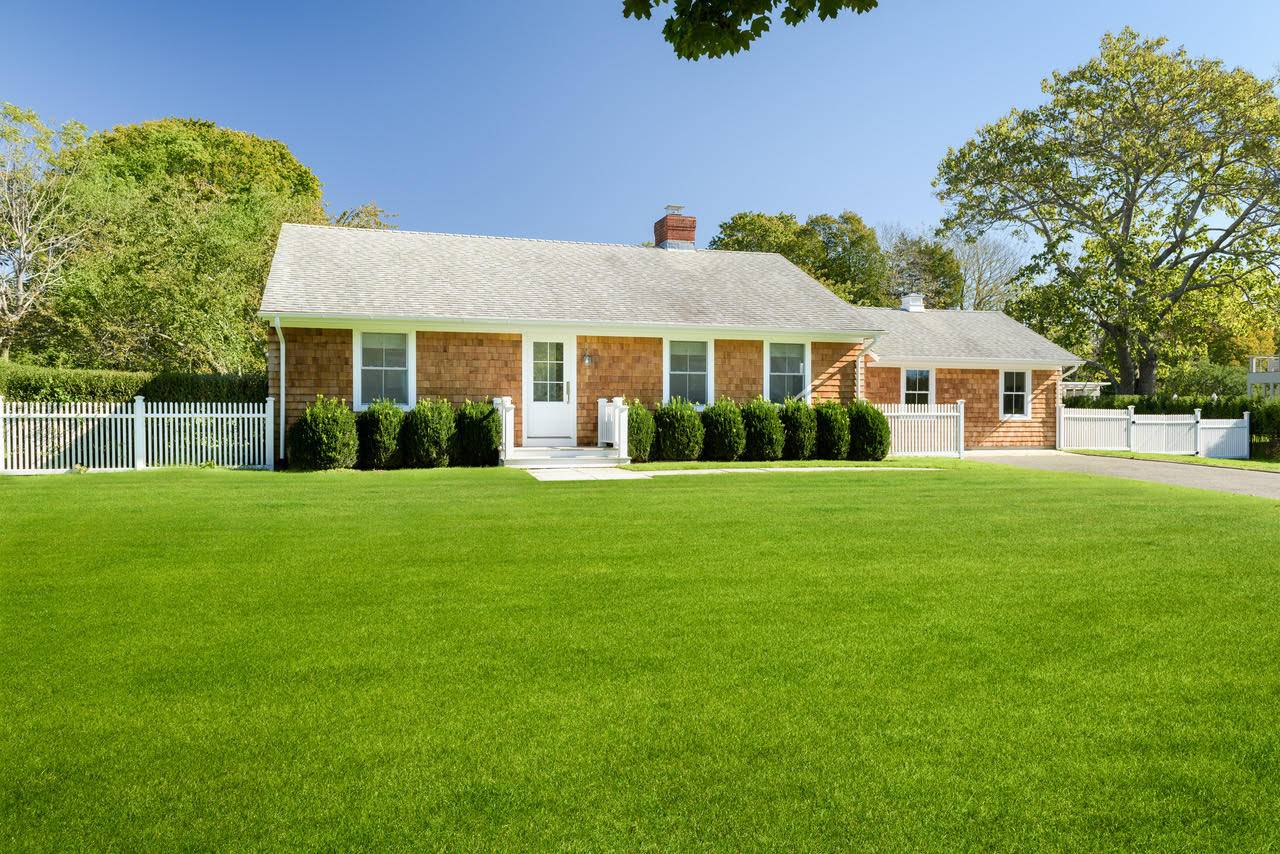 a front view of a house with a yard