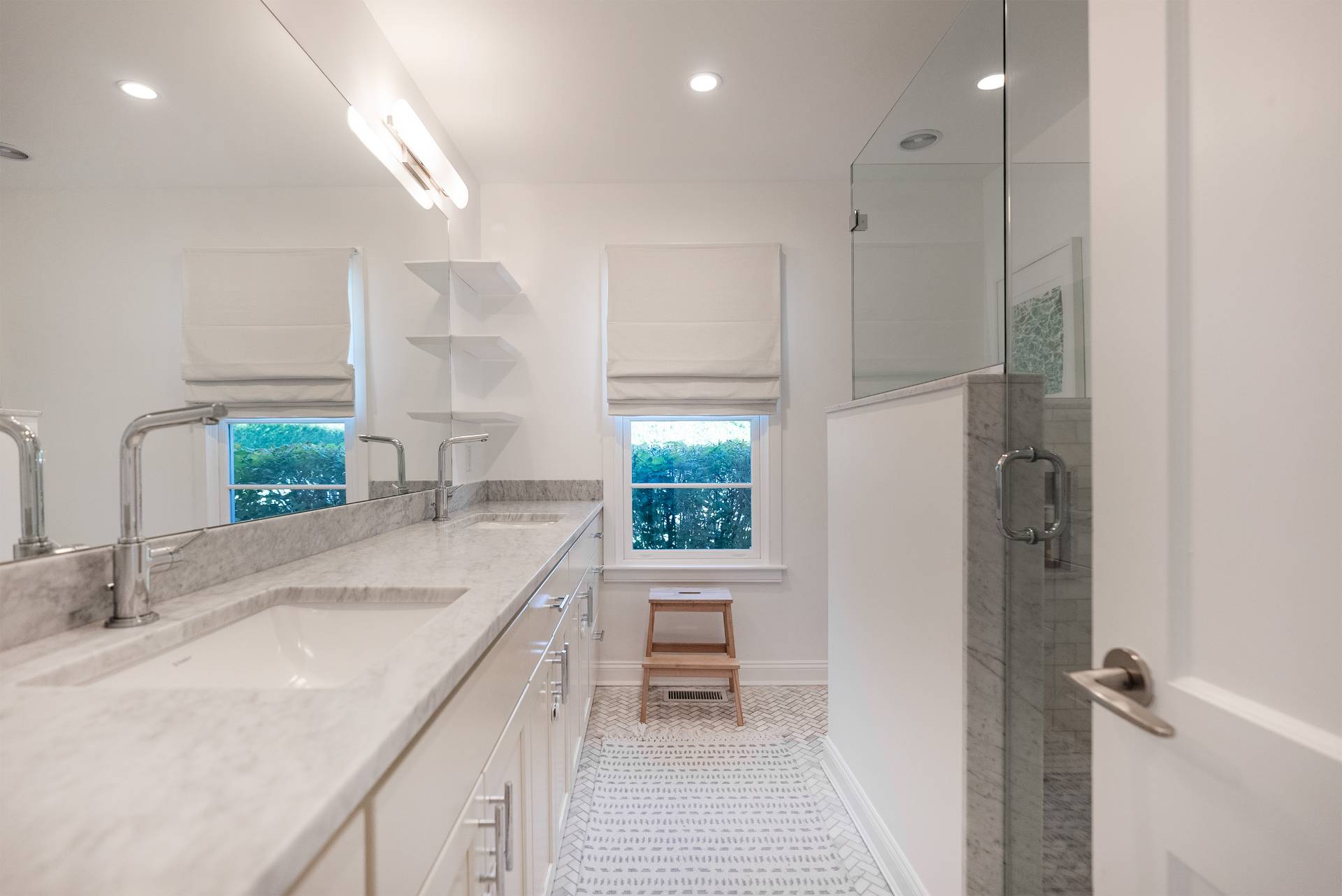 Undisclosed Address Bridgehampton, NY 11932 - Photo 11 of 25 a kitchen with a sink stove and cabinets