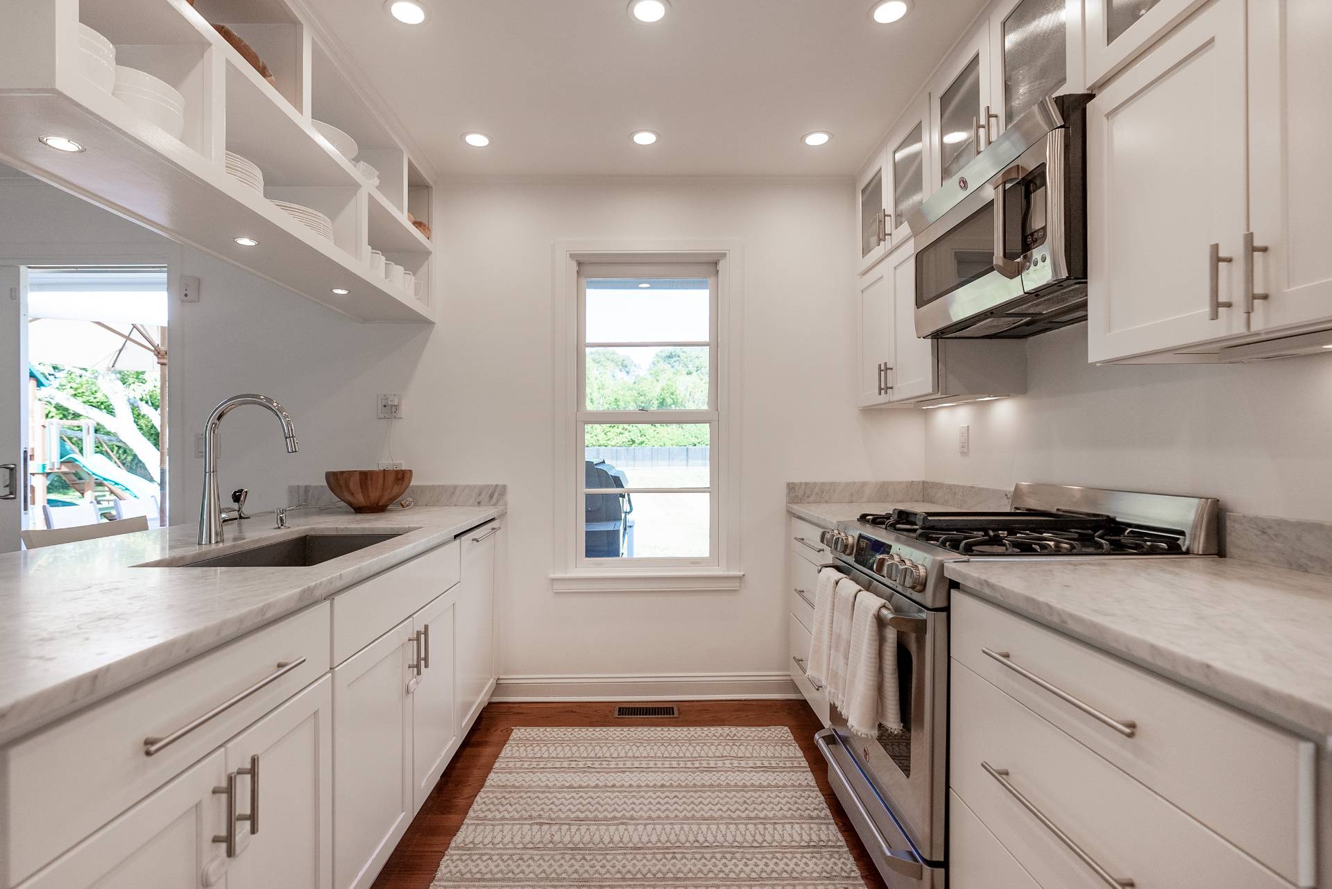 Undisclosed Address Bridgehampton, NY 11932 - Photo 10 of 25 a kitchen with stainless steel appliances granite countertop a sink and a stove