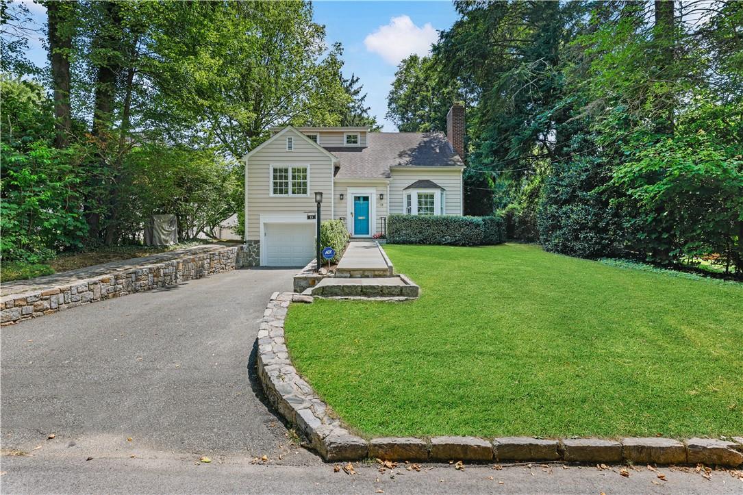 13 Wynmor Road Scarsdale, NY 10583 - Photo 1 of 1 a front view of a house with a yard