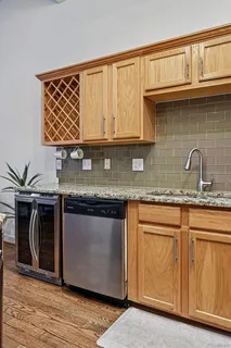 a kitchen with granite countertop a sink and a stove