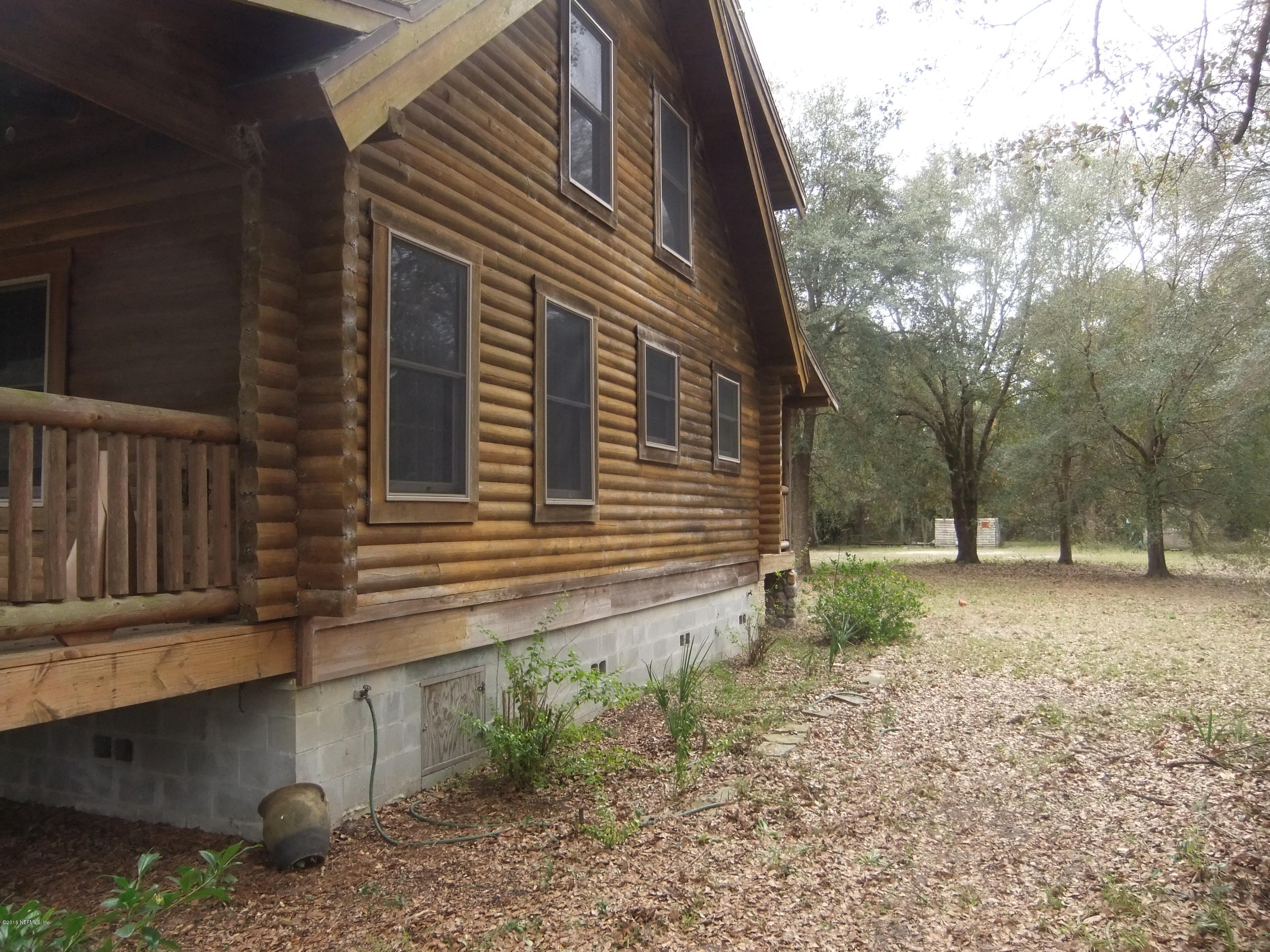 1700 Lake Road Jacksonville, FL 32226 - Photo 28 of 46 a backyard of a house with lots of green space