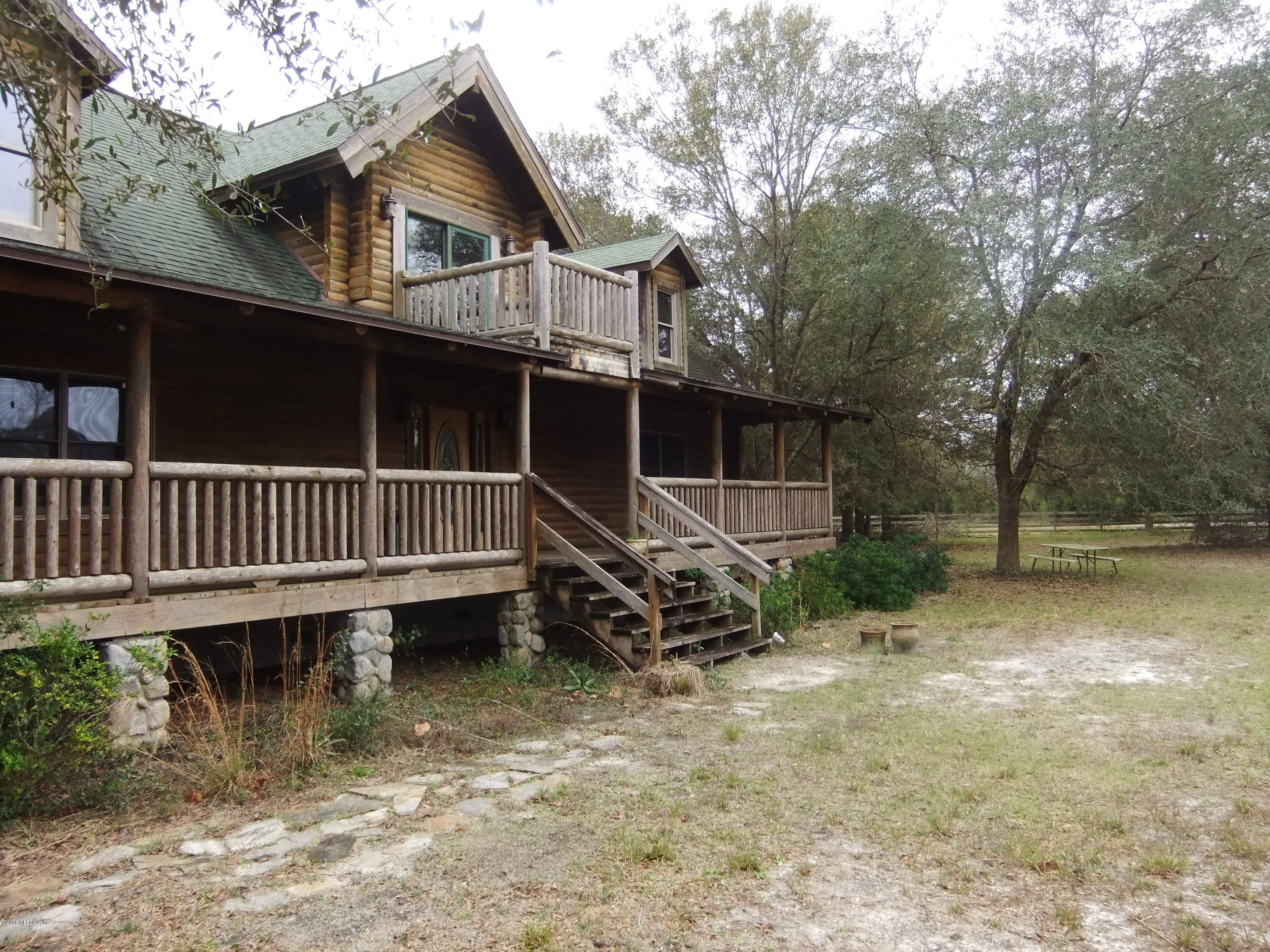 1700 Lake Road Jacksonville, FL 32226 - Photo 3 of 46 a view of a house with a wooden deck and a yard