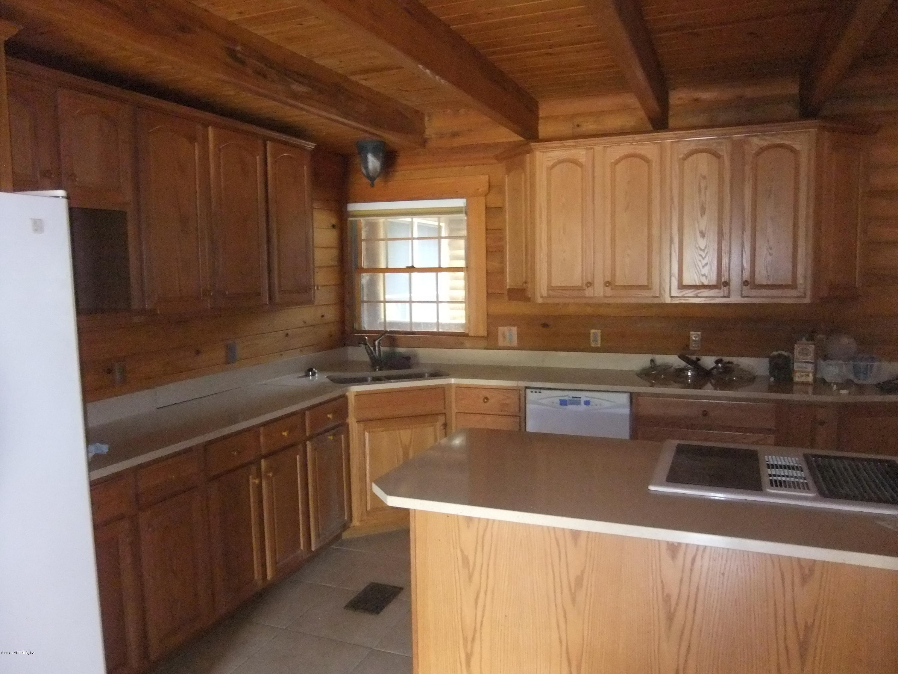 1700 Lake Road Jacksonville, FL 32226 - Photo 10 of 46 a kitchen with stainless steel appliances granite countertop a sink a stove and a refrigerator