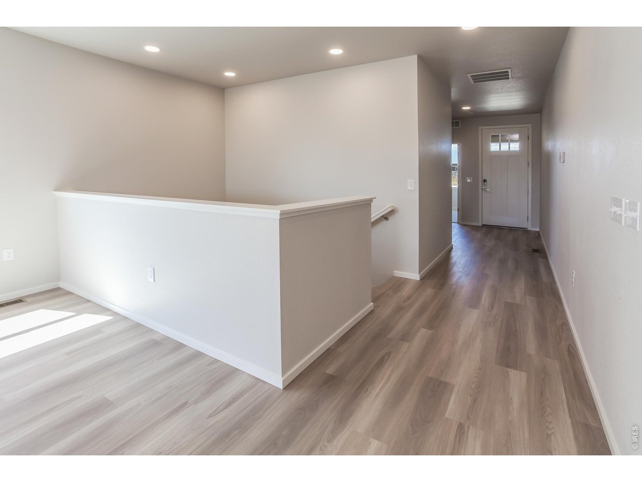 792 Chatter Road Windsor, CO 80550 - Photo 9 of 49 a view of hallway with wooden floor