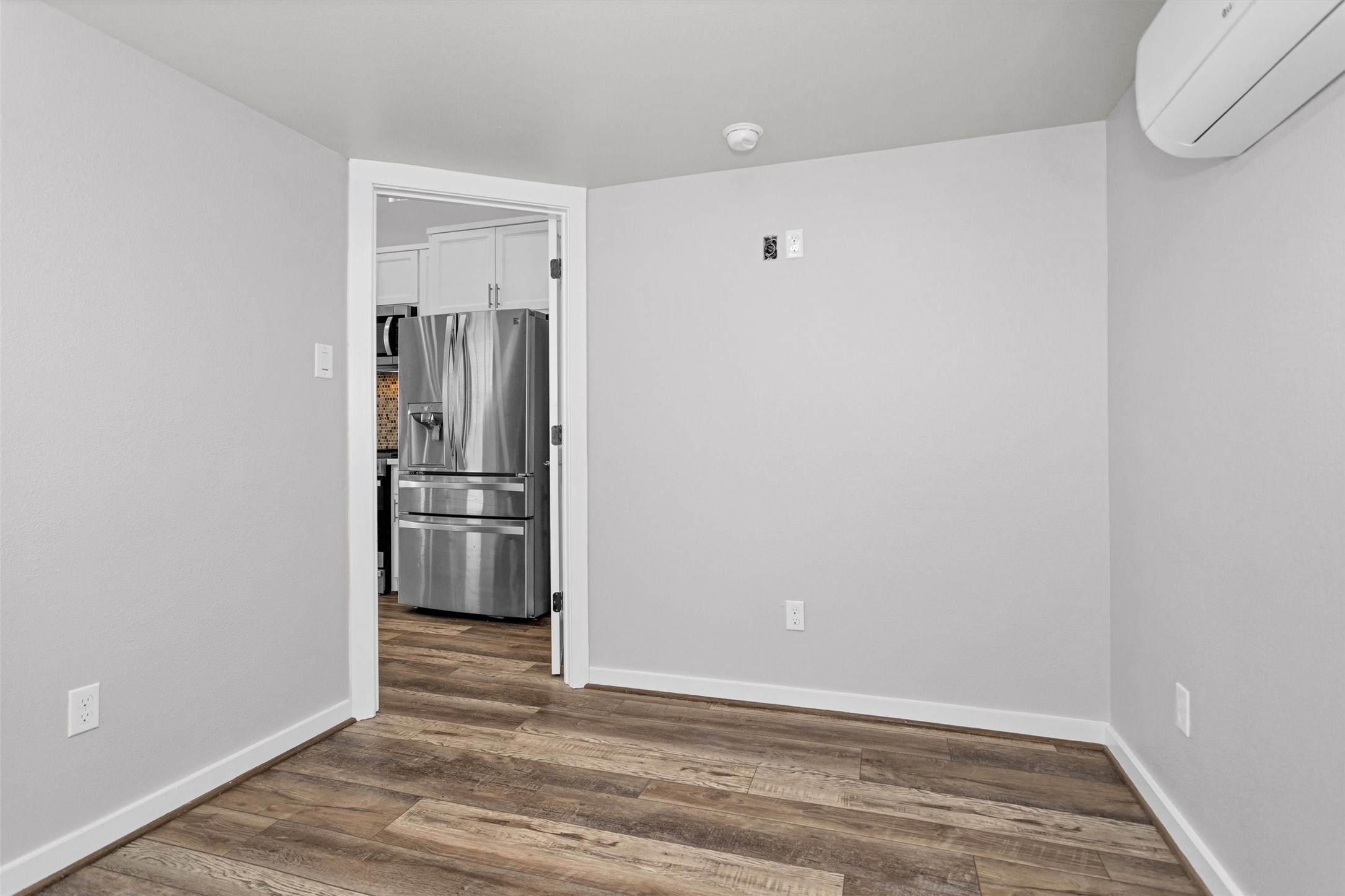 12922 Longstreet Road, Unit 711 Willis, TX 77318 - Photo 11 of 29 a view of a kitchen with a sink and refrigerator