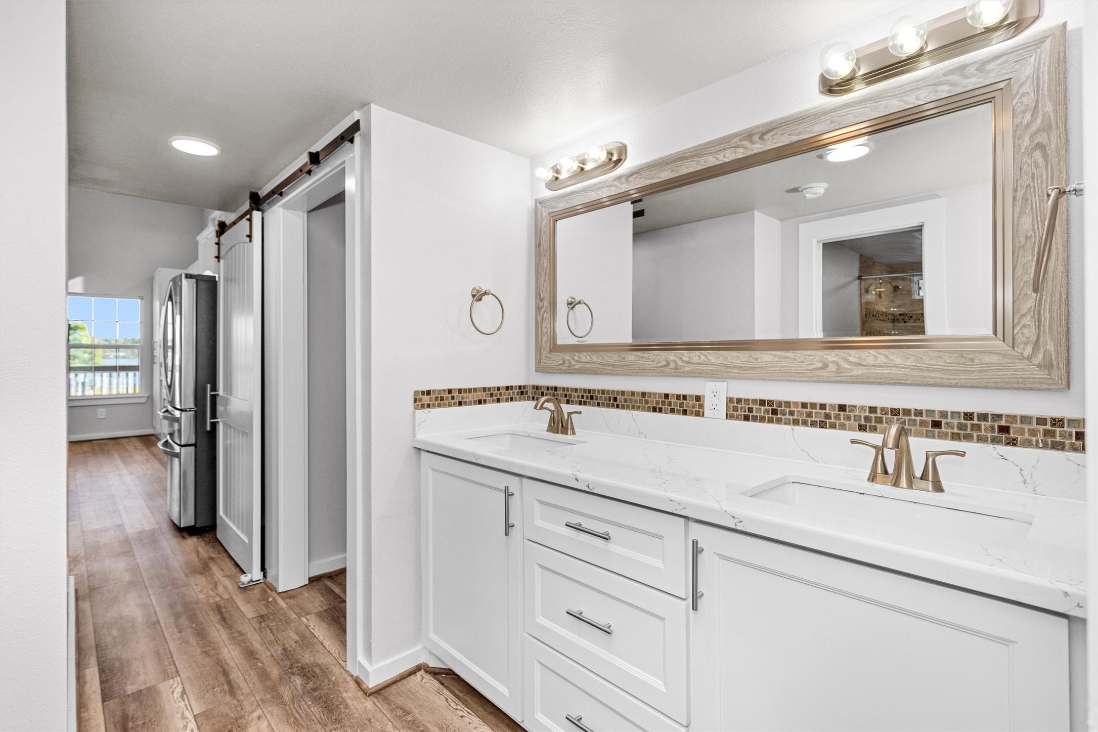 12922 Longstreet Road, Unit 711 Willis, TX 77318 - Photo 12 of 29 a bathroom with a sink and a mirror