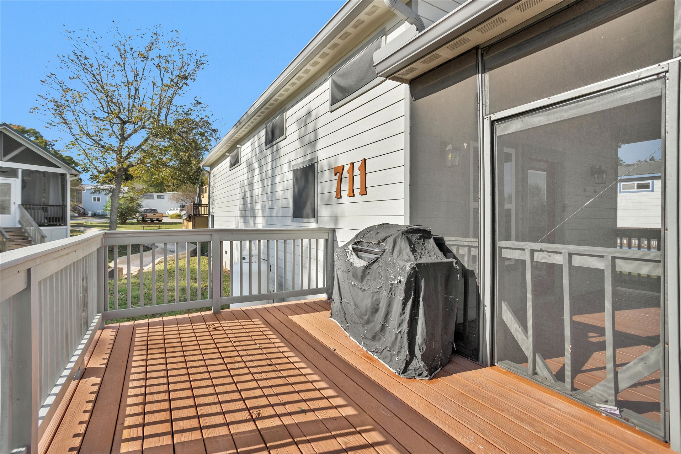 12922 Longstreet Road, Unit 711 Willis, TX 77318 - Photo 19 of 29 a view of a balcony with wooden floor